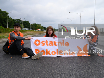 Climate activists from the Last Generation (Ostatnia Generacja) are blocking a main road to protest against the inaction of politicians towa...