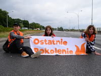 Climate activists from the Last Generation (Ostatnia Generacja) are blocking a main road to protest against the inaction of politicians towa...