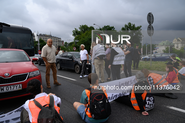 Climate activists from the Last Generation (Ostatnia Generacja) are blocking a main road to protest against the inaction of politicians towa...