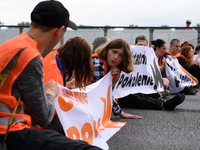 Climate activists from the Last Generation (Ostatnia Generacja) are blocking a main road to protest against the inaction of politicians towa...