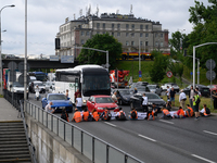 Climate activists from the Last Generation (Ostatnia Generacja) are blocking a main road to protest against the inaction of politicians towa...