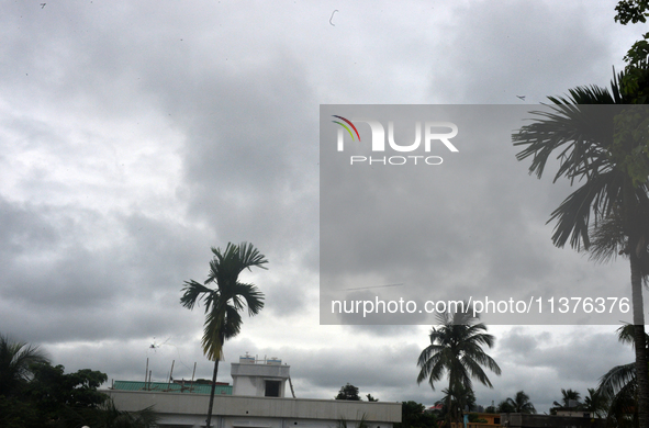 Dark rain clouds are looming over the skyline in Siliguri, India, on July 1, 2024. 