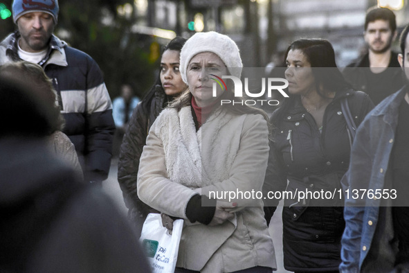 Pedestrians are facing a freezing winter morning on Avenida Paulista in Sao Paulo, on July 01, 2024. 