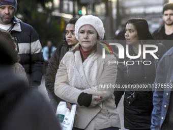 Pedestrians are facing a freezing winter morning on Avenida Paulista in Sao Paulo, on July 01, 2024. (