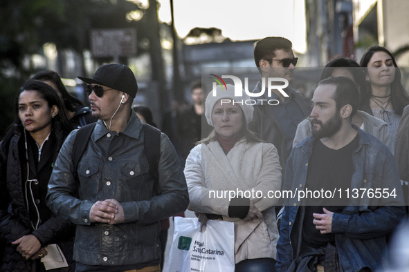 Pedestrians are facing a freezing winter morning on Avenida Paulista in Sao Paulo, on July 01, 2024. 