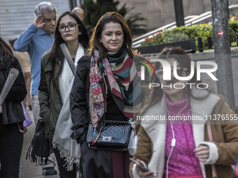 Pedestrians are facing a freezing winter morning on Avenida Paulista in Sao Paulo, on July 01, 2024. (