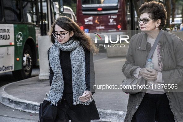 Pedestrians are facing a freezing winter morning on Avenida Paulista in Sao Paulo, on July 01, 2024. 