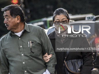 Pedestrians are facing a freezing winter morning on Avenida Paulista in Sao Paulo, on July 01, 2024. (