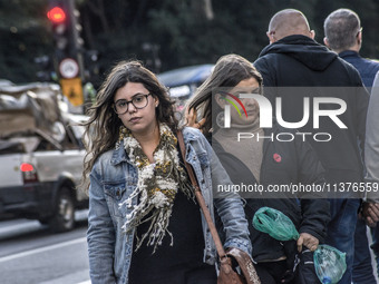 Pedestrians are facing a freezing winter morning on Avenida Paulista in Sao Paulo, on July 01, 2024. (