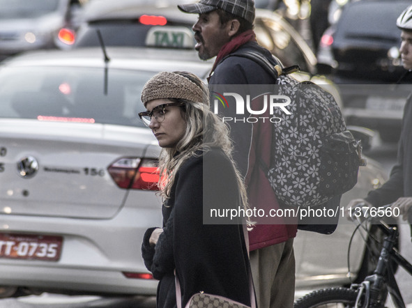 Pedestrians are facing a freezing winter morning on Avenida Paulista in Sao Paulo, on July 01, 2024. 