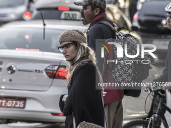 Pedestrians are facing a freezing winter morning on Avenida Paulista in Sao Paulo, on July 01, 2024. (