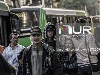 Pedestrians are facing a freezing winter morning on Avenida Paulista in Sao Paulo, on July 01, 2024. (