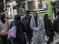 Pedestrians are facing a freezing winter morning on Avenida Paulista in Sao Paulo, on July 01, 2024. (