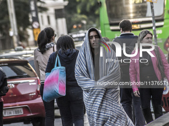 Pedestrians are facing a freezing winter morning on Avenida Paulista in Sao Paulo, on July 01, 2024. (