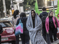 Pedestrians are facing a freezing winter morning on Avenida Paulista in Sao Paulo, on July 01, 2024. (