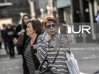 Pedestrians are facing a freezing winter morning on Avenida Paulista in Sao Paulo, on July 01, 2024. (