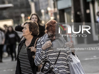 Pedestrians are facing a freezing winter morning on Avenida Paulista in Sao Paulo, on July 01, 2024. (