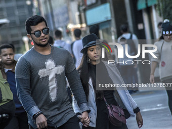 Pedestrians are facing a freezing winter morning on Avenida Paulista in Sao Paulo, on July 01, 2024. (