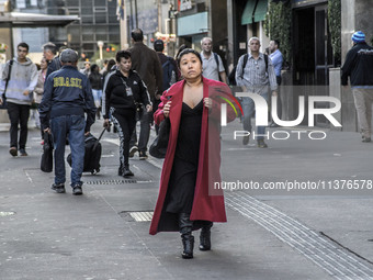 Pedestrians are facing a freezing winter morning on Avenida Paulista in Sao Paulo, on July 01, 2024. (