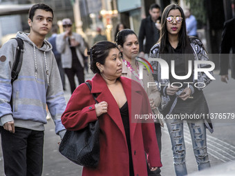 Pedestrians are facing a freezing winter morning on Avenida Paulista in Sao Paulo, on July 01, 2024. (