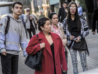 Pedestrians are facing a freezing winter morning on Avenida Paulista in Sao Paulo, on July 01, 2024. (