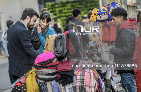 Pedestrians are facing a freezing winter morning on Avenida Paulista in Sao Paulo, on July 01, 2024. 