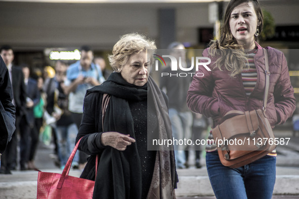 Pedestrians are facing a freezing winter morning on Avenida Paulista in Sao Paulo, on July 01, 2024. 