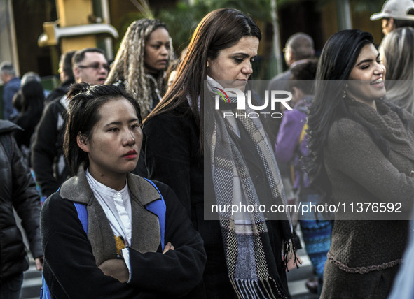 Pedestrians are facing a freezing winter morning on Avenida Paulista in Sao Paulo, on July 01, 2024. 