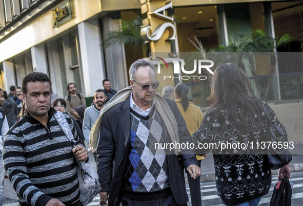 Pedestrians are facing a freezing winter morning on Avenida Paulista in Sao Paulo, on July 01, 2024. 