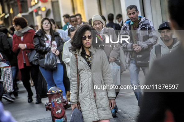 Pedestrians are facing a freezing winter morning on Avenida Paulista in Sao Paulo, on July 01, 2024. 