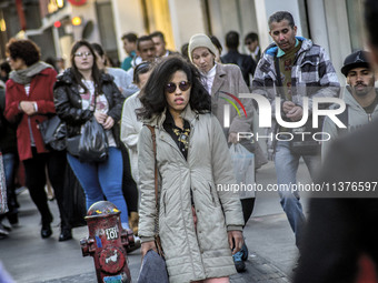 Pedestrians are facing a freezing winter morning on Avenida Paulista in Sao Paulo, on July 01, 2024. (