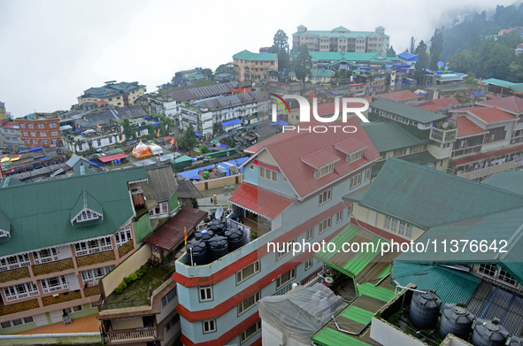 Houses and commercial hotels are being seen during rainfall in Darjeeling, India, on July 1, 2024. Darjeeling is a famous tourist destinatio...