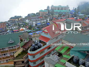 Houses and commercial hotels are being seen during rainfall in Darjeeling, India, on July 1, 2024. Darjeeling is a famous tourist destinatio...