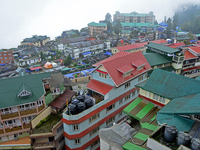 Houses and commercial hotels are being seen during rainfall in Darjeeling, India, on July 1, 2024. Darjeeling is a famous tourist destinatio...