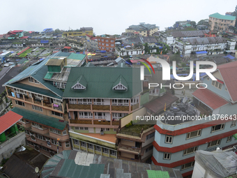 Houses and commercial hotels are being seen during rainfall in Darjeeling, India, on July 1, 2024. Darjeeling is a famous tourist destinatio...