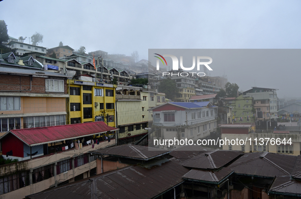 Houses and commercial hotels are being seen during rainfall in Darjeeling, India, on July 1, 2024. Darjeeling is a famous tourist destinatio...