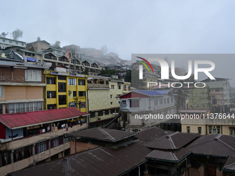 Houses and commercial hotels are being seen during rainfall in Darjeeling, India, on July 1, 2024. Darjeeling is a famous tourist destinatio...