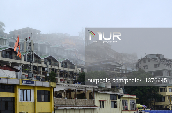 Houses and commercial hotels are being seen during rainfall in Darjeeling, India, on July 1, 2024. Darjeeling is a famous tourist destinatio...