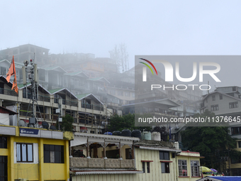 Houses and commercial hotels are being seen during rainfall in Darjeeling, India, on July 1, 2024. Darjeeling is a famous tourist destinatio...