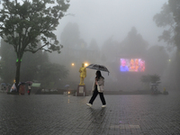 A pedestrian is carrying an umbrella during heavy rainfall in Darjeeling, India, on July 1, 2024. Darjeeling is a famous tourist destination...