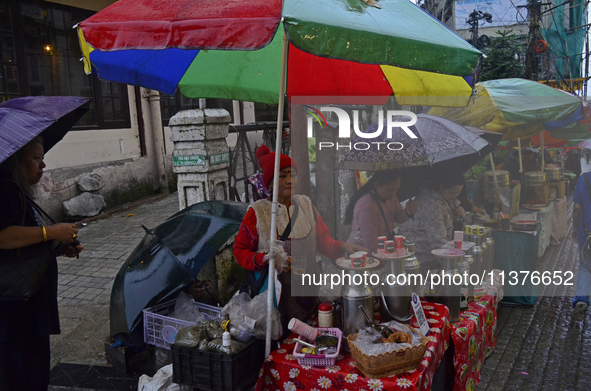 Roadside food stalls are being seen during heavy rainfall in Darjeeling, India, on July 1, 2024. Darjeeling is a famous tourist destination...