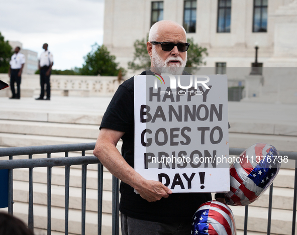 Trump opponent Bill Christeson, a DC-area resident, demonstrates at the U. S. Supreme Court as it issues the last remaining opinions of the...