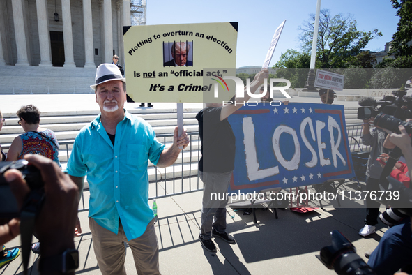 Trump opponents demonstrate outside the U.S. Supreme Court as it issues the last remaining opinions of the term, including a decision on Don...