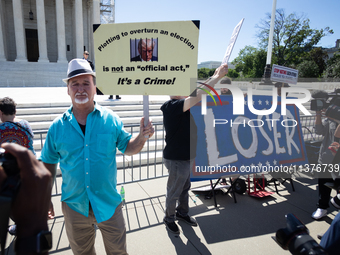 Trump opponents demonstrate outside the U.S. Supreme Court as it issues the last remaining opinions of the term, including a decision on Don...