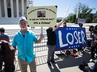 Trump opponents demonstrate outside the U.S. Supreme Court as it issues the last remaining opinions of the term, including a decision on Don...