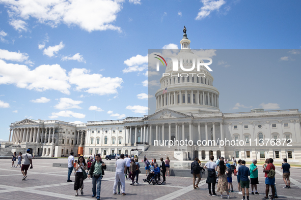 Tourists visit the U.S. Capitol as the Supreme Court issues the last remaining opinions of the term, including a decision on Donald Trump's...