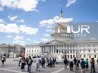 Tourists visit the U.S. Capitol as the Supreme Court issues the last remaining opinions of the term, including a decision on Donald Trump's...