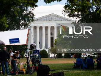 News outlets stage in front of the U. S. Supreme Court as it issues the last remaining opinions of the term, including a decision on Donald...