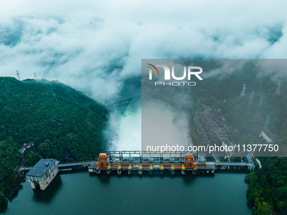 Flood discharge is happening from the Xin 'an River Dam in Hangzhou, China, on June 26, 2024. 