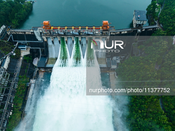 Flood discharge is happening from the Xin 'an River Dam in Hangzhou, China, on June 26, 2024. 